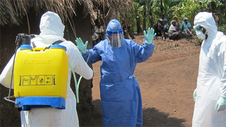 Epidemiologists wear hazard protective gear and perform decontamination procedures.